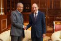 Akbar (right) shaking hands with Dr Mahathir to discuss issues of mutual interest