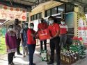 Sunway Lost World of Tambun general manager Nurul Nuzairi distributing food aid to beneficiaries at SJK(T) Klebang, Chemor, Perak